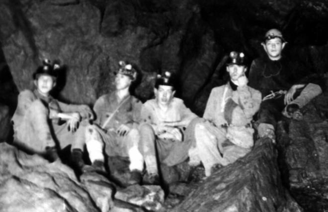 An old black and white photo of early MCG cavers.