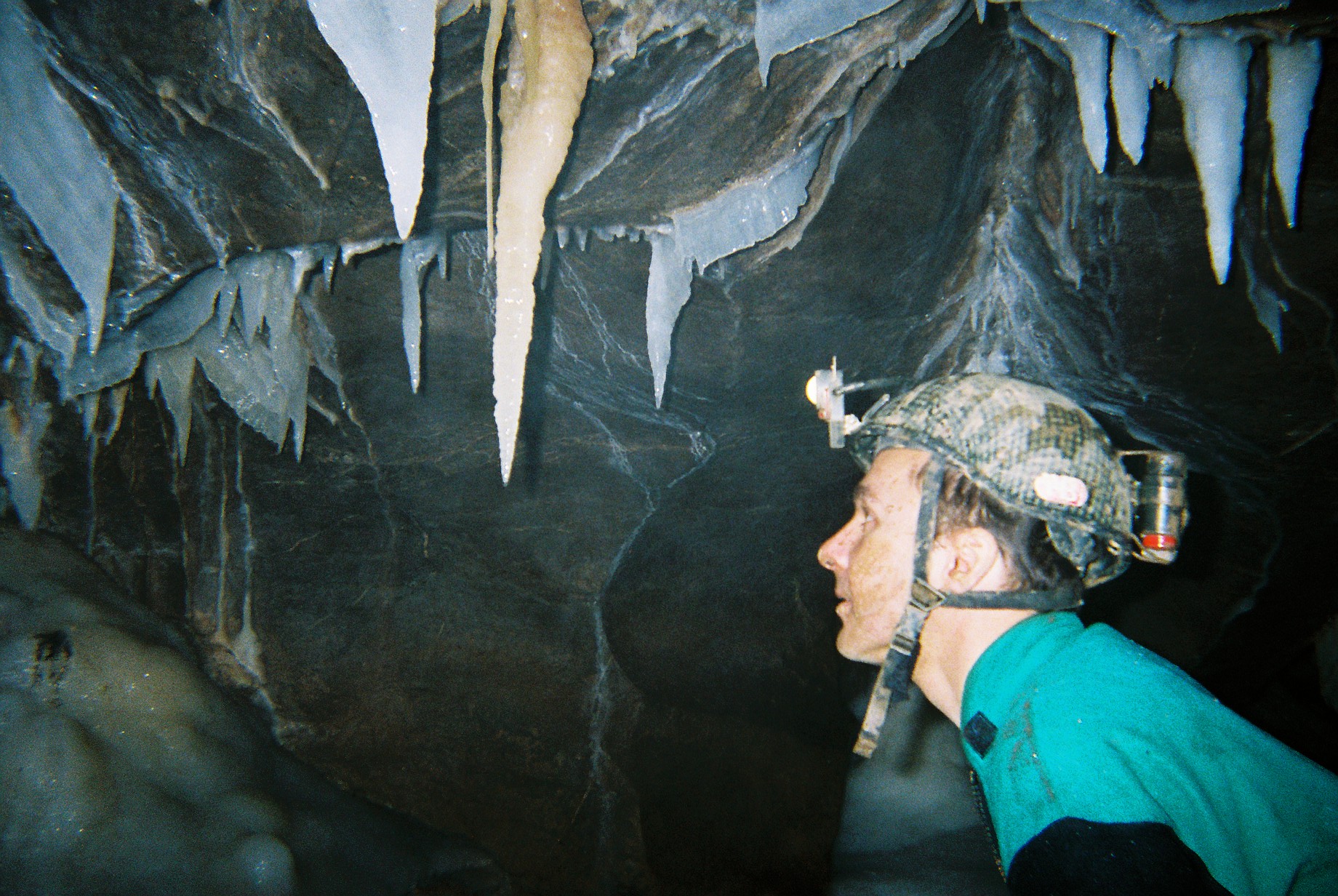 A caver in the streamway of Upper Flood Swallet