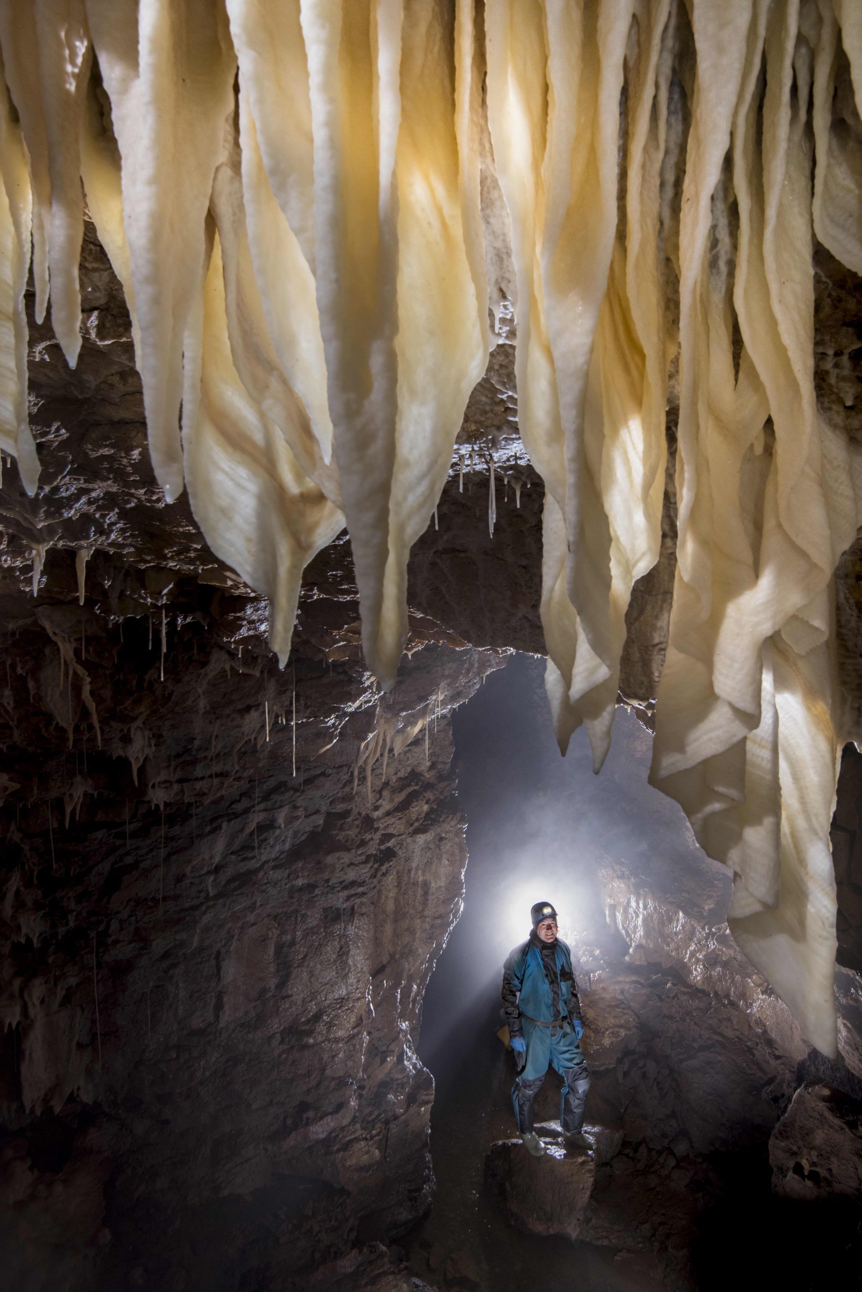 Cave underneath beautiful stalactite curtains