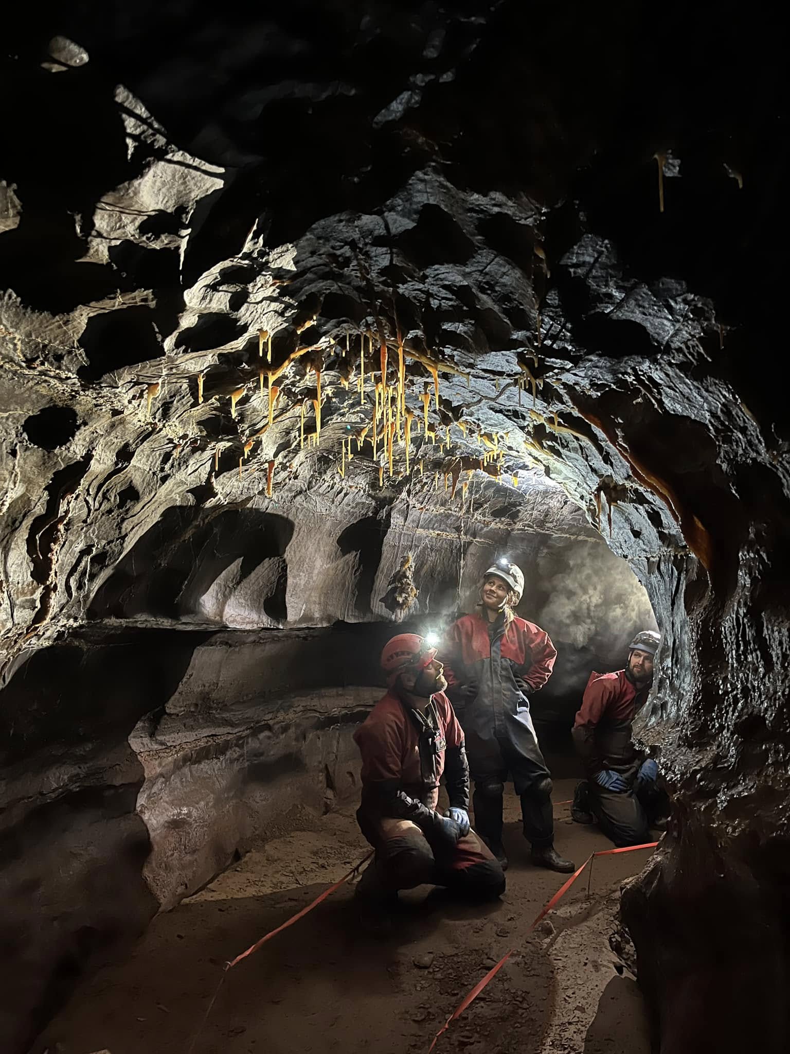A large cave entrance in a Welsh valley