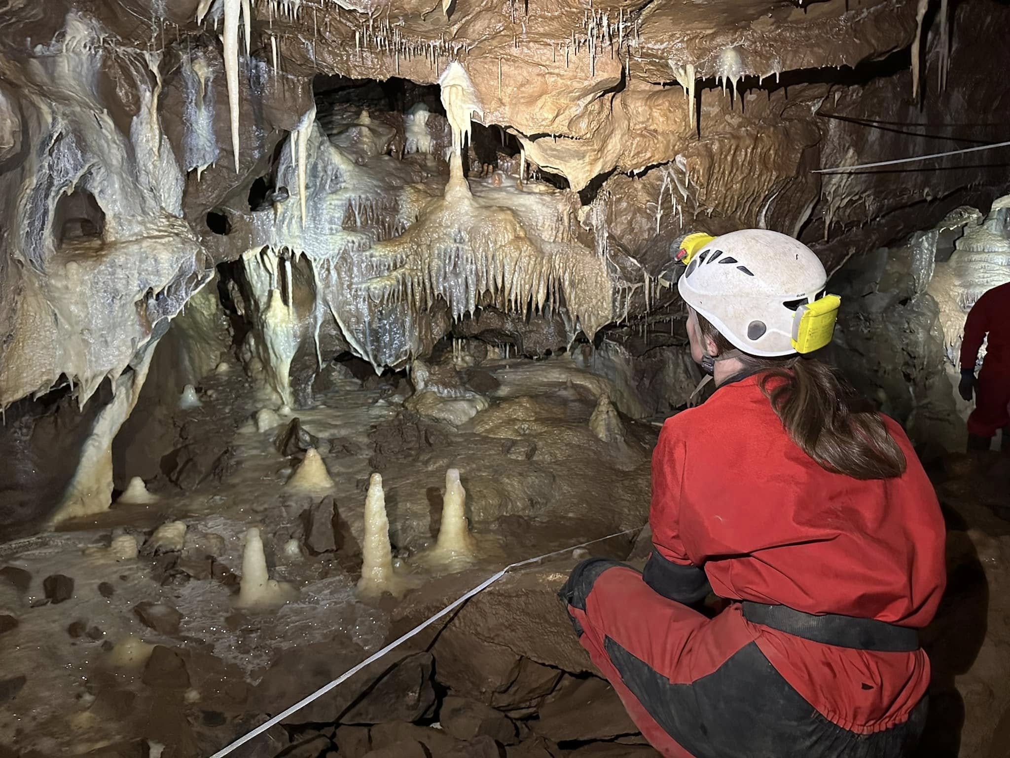 A caver looking at a map