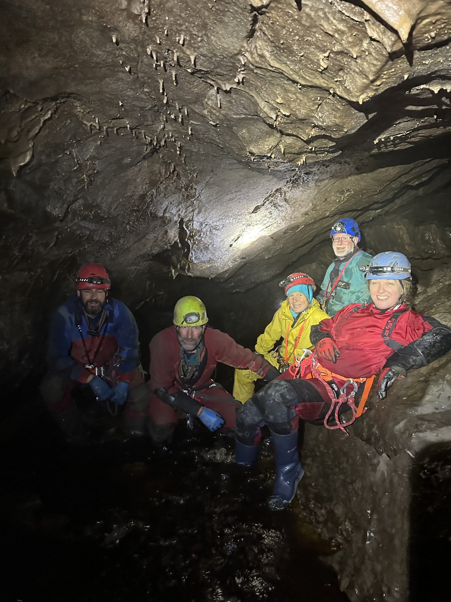A caver descending a deep shaft in Yorkshire